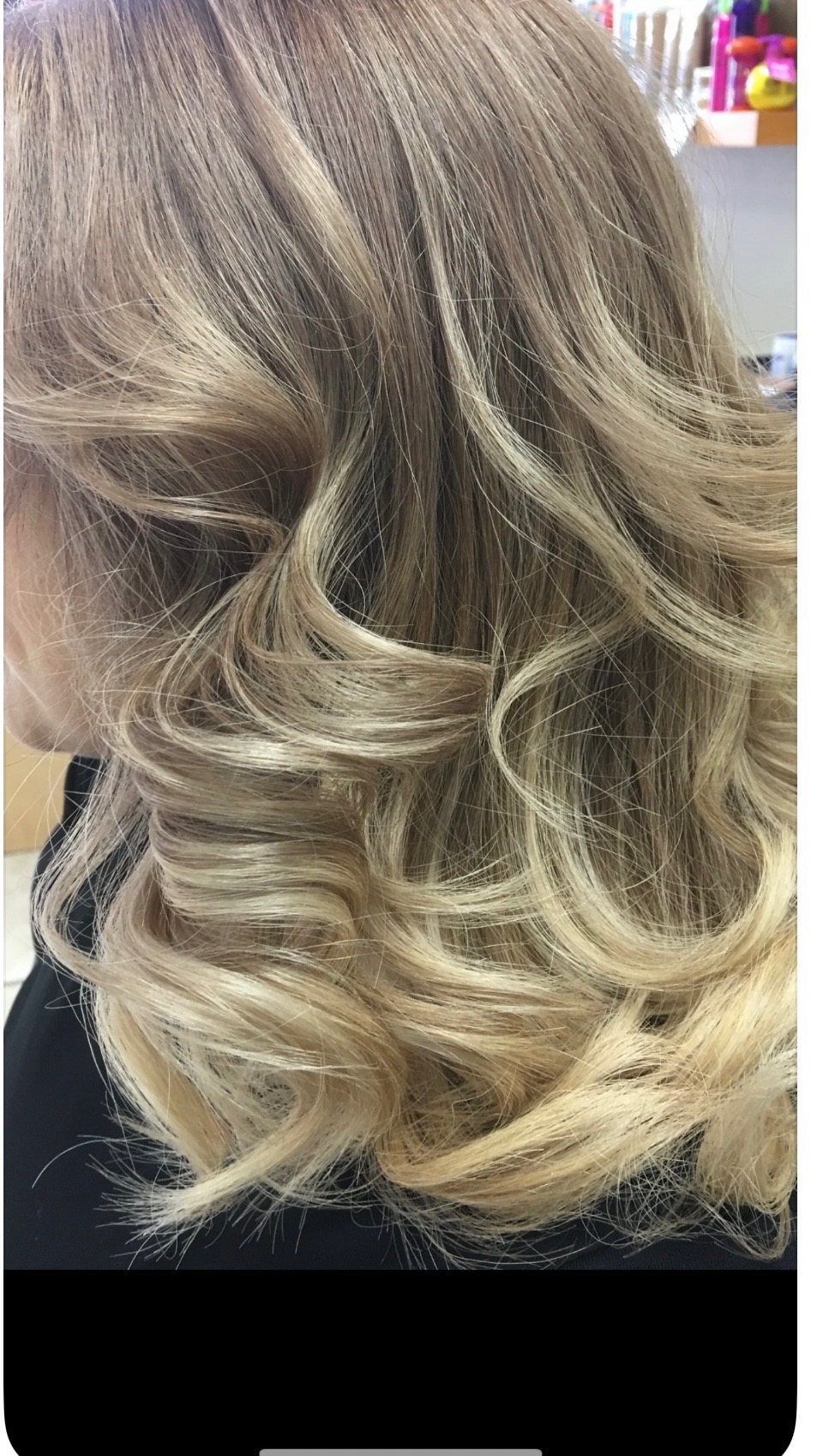 Bouncy blonde curls with dimensional highlights