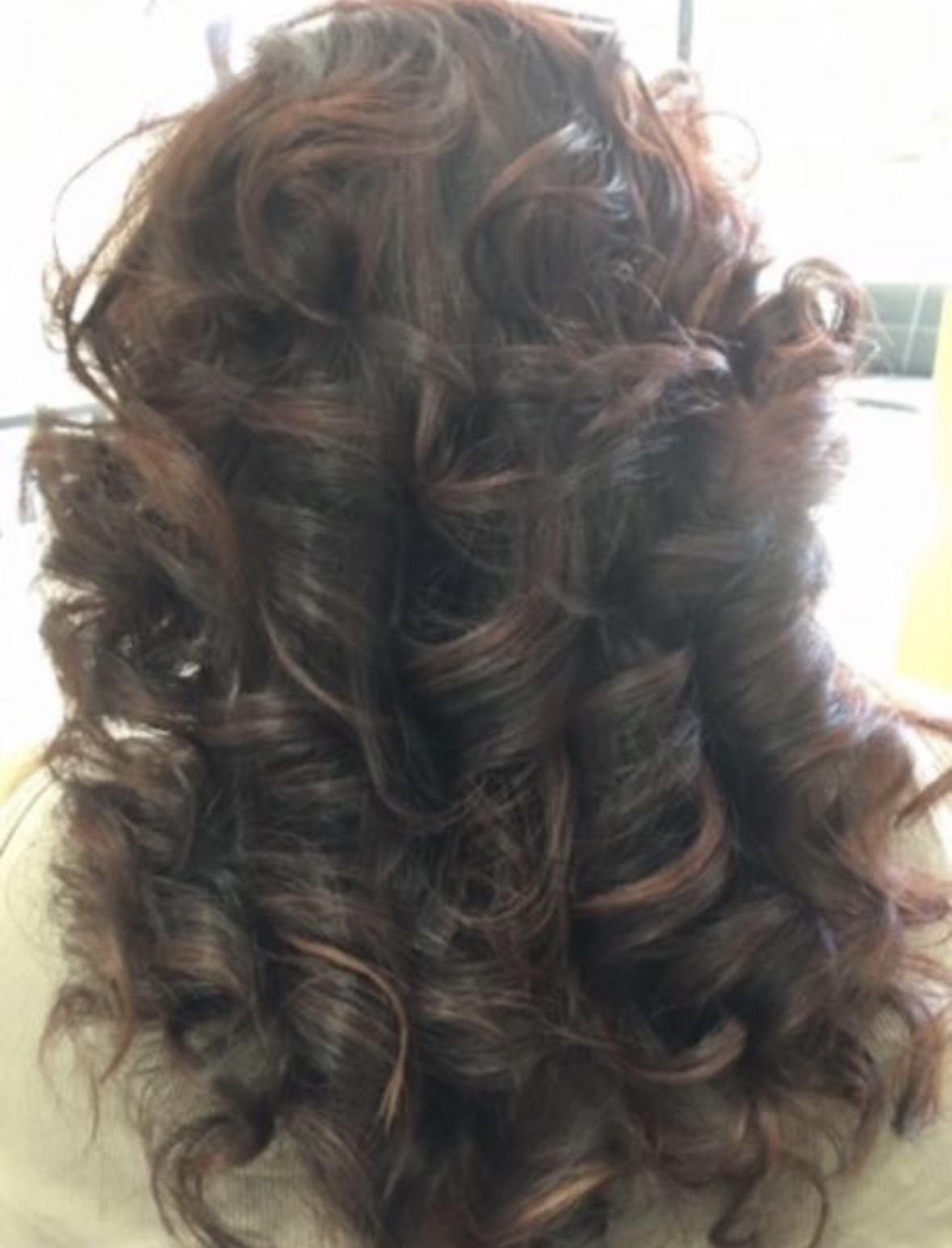 Voluminous glossy brunette curls