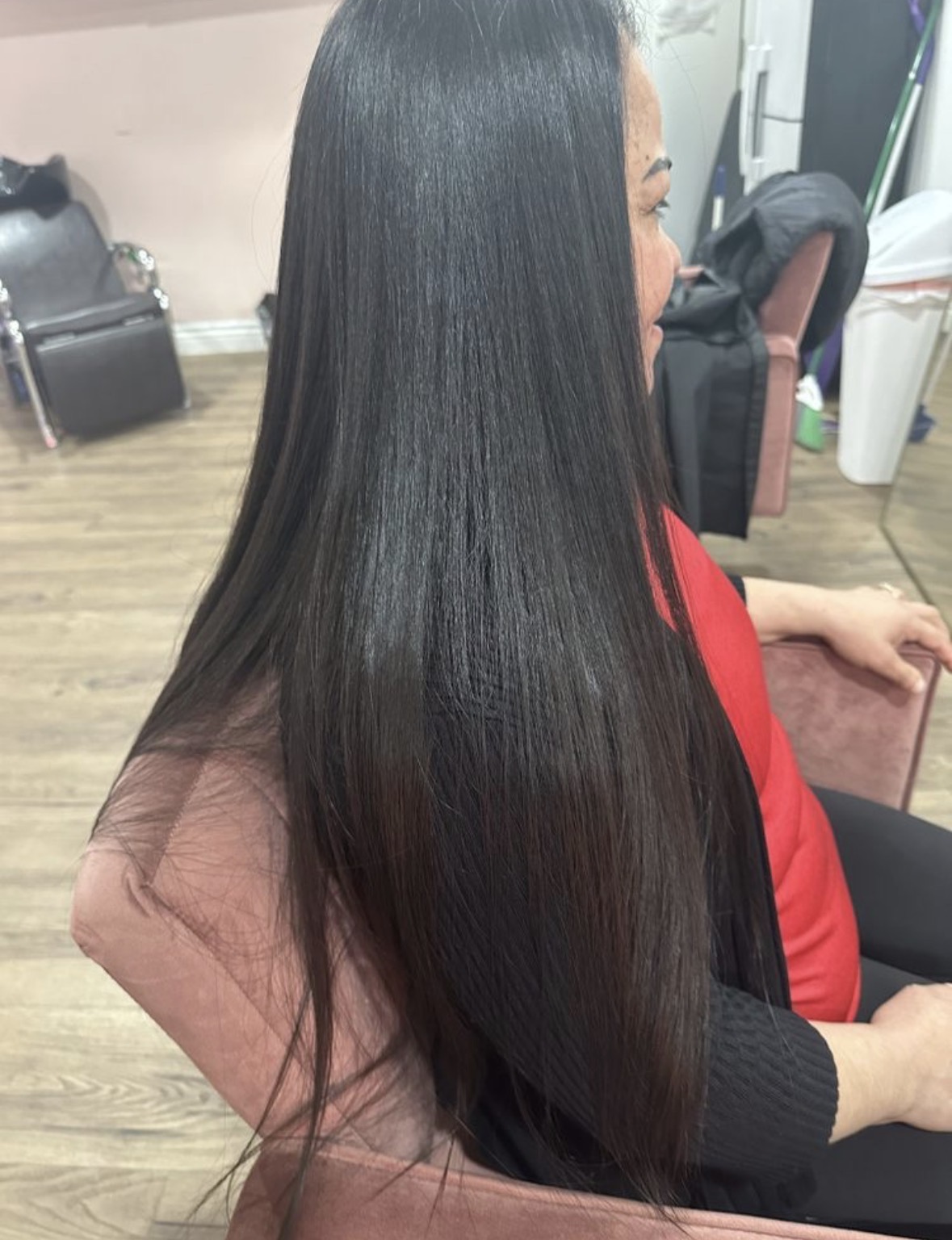 Sleek jet-black straight hair styling